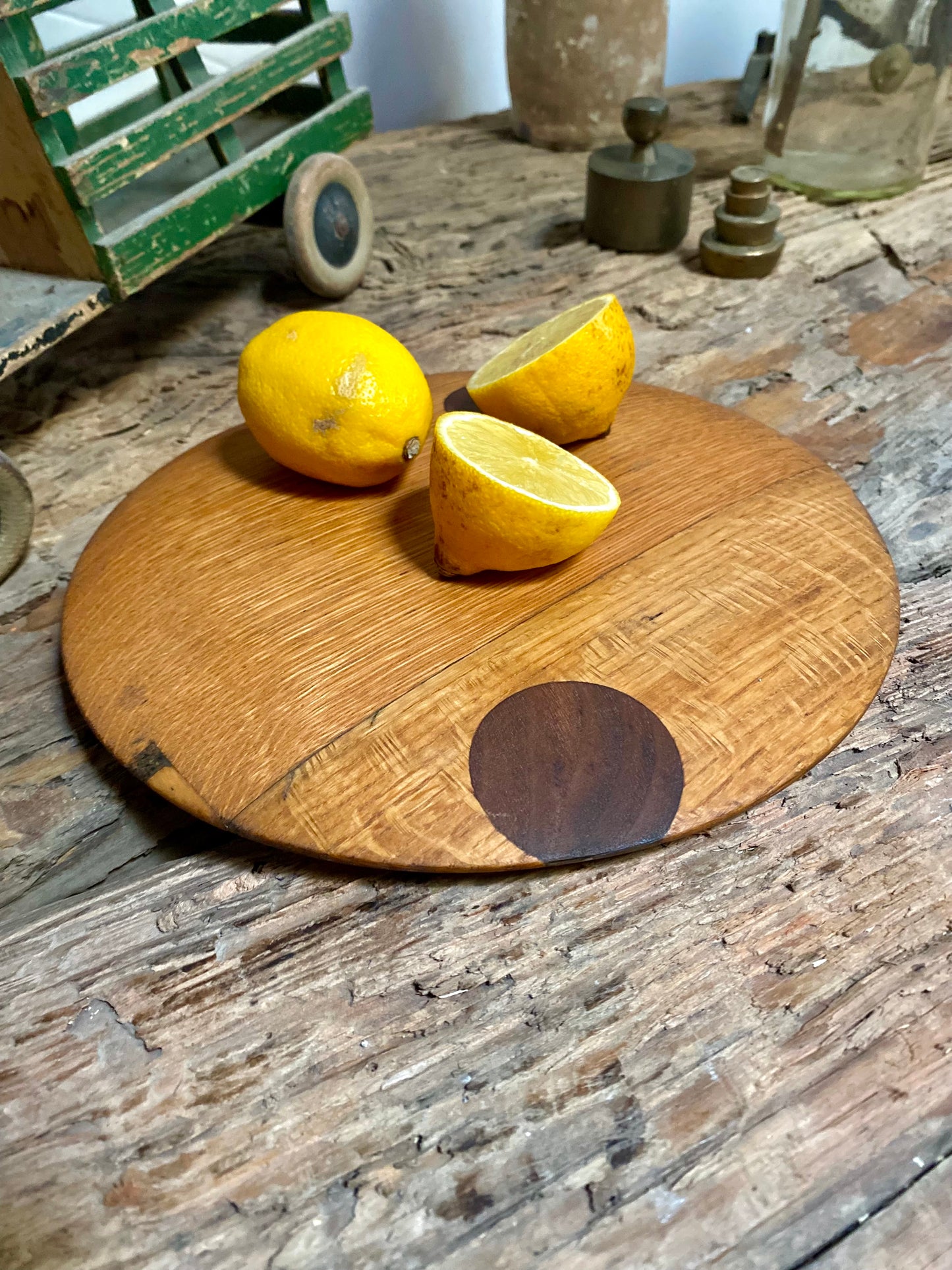 Round cutting serving tray board made with reclaimed oak with traditional walnut bowtie joinery