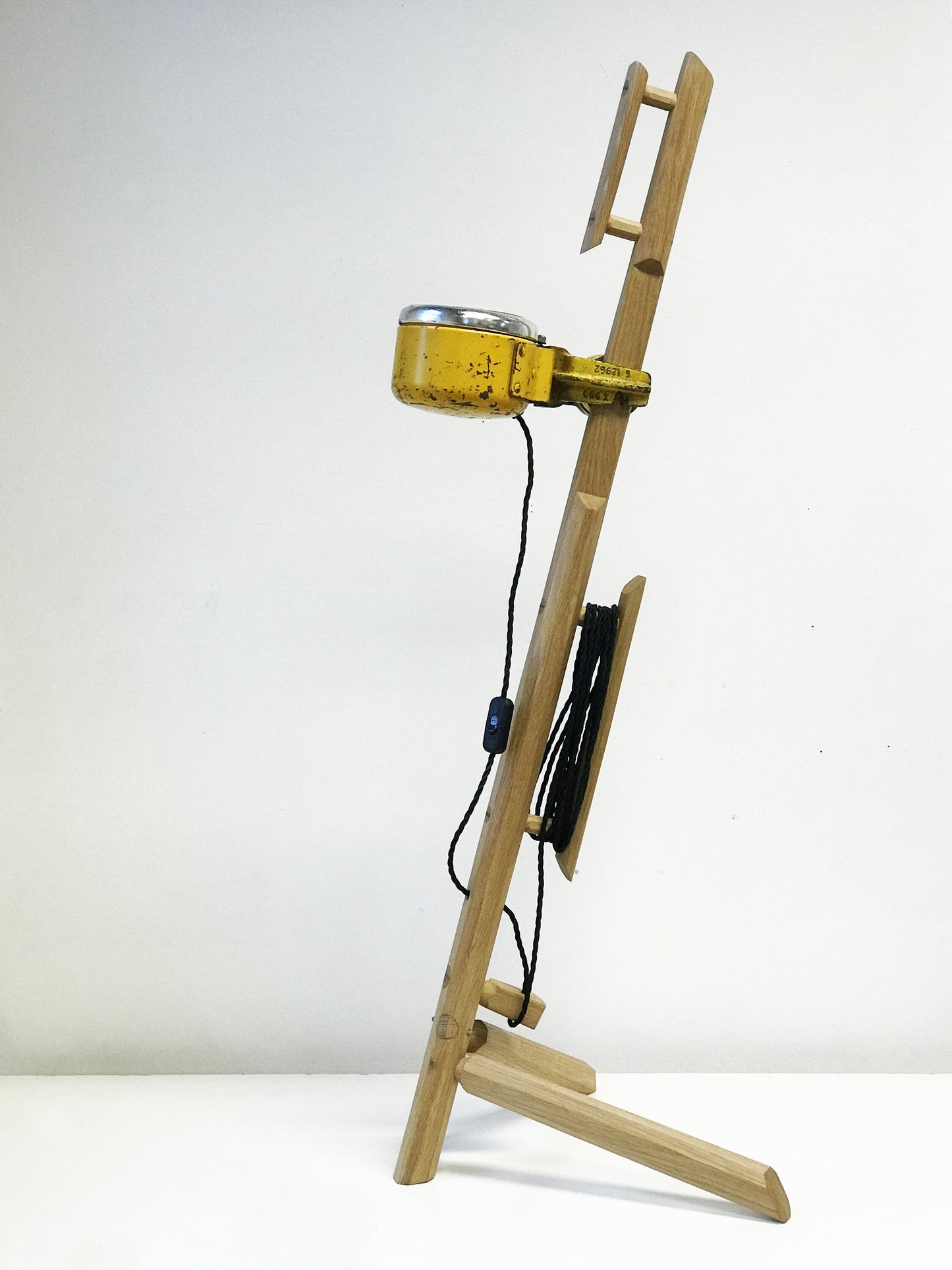 Vintage industrial light blended with a rustic oak frame