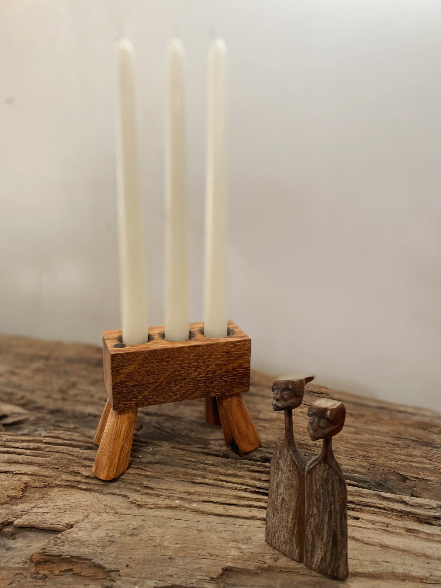 Rustic reclaimed oak triple-candle holder, handcrafted with precision from whisky barrels. A perfect centerpiece or ambient lighting accent, bringing warmth and sustainability to your home
