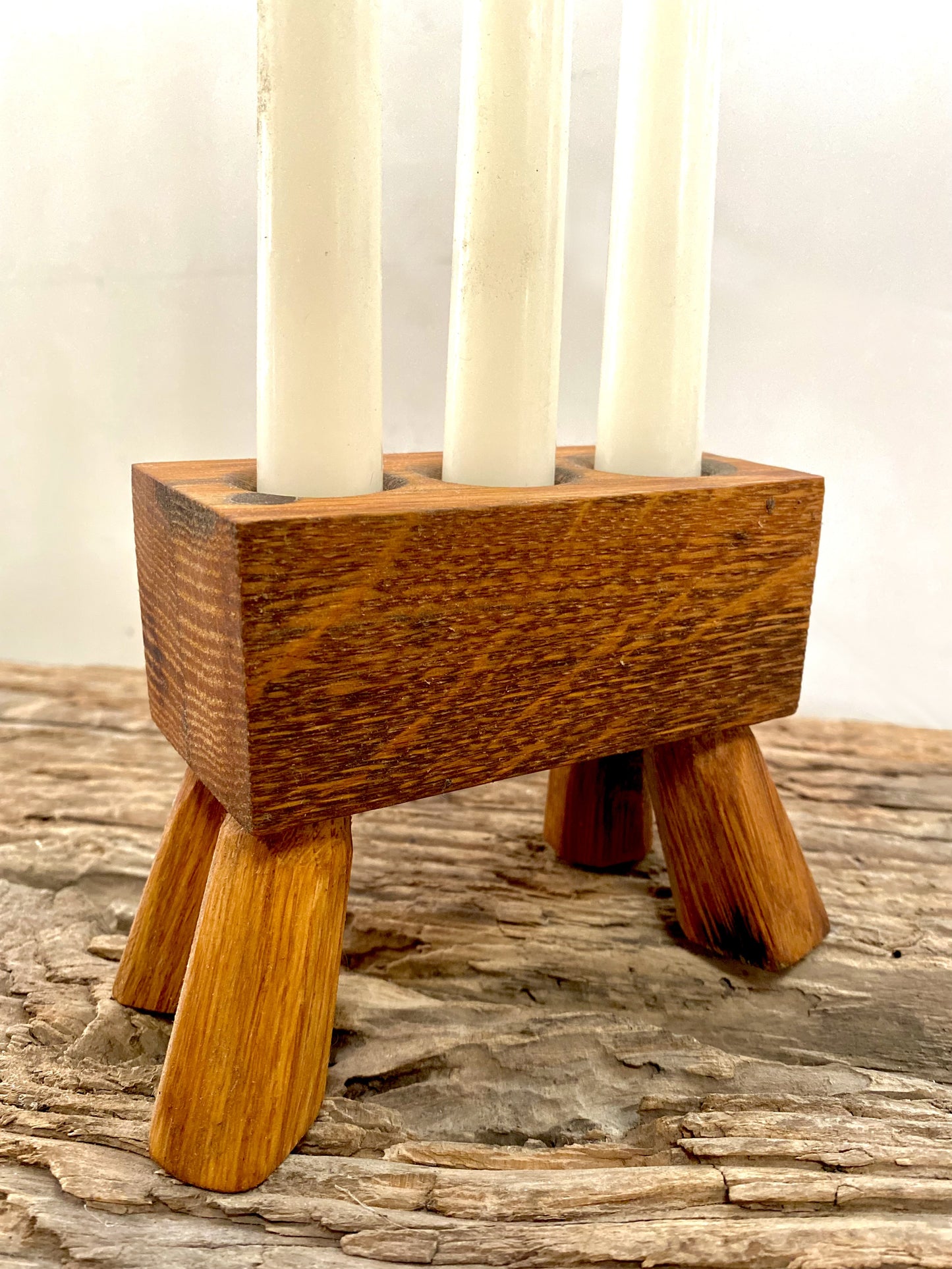 Elegant triple-candle holder made from reclaimed oak whisky barrels. Precision-crafted for ambient home lighting, ideal for a rustic dining table, spa-like bath, or eco-conscious gift-giving