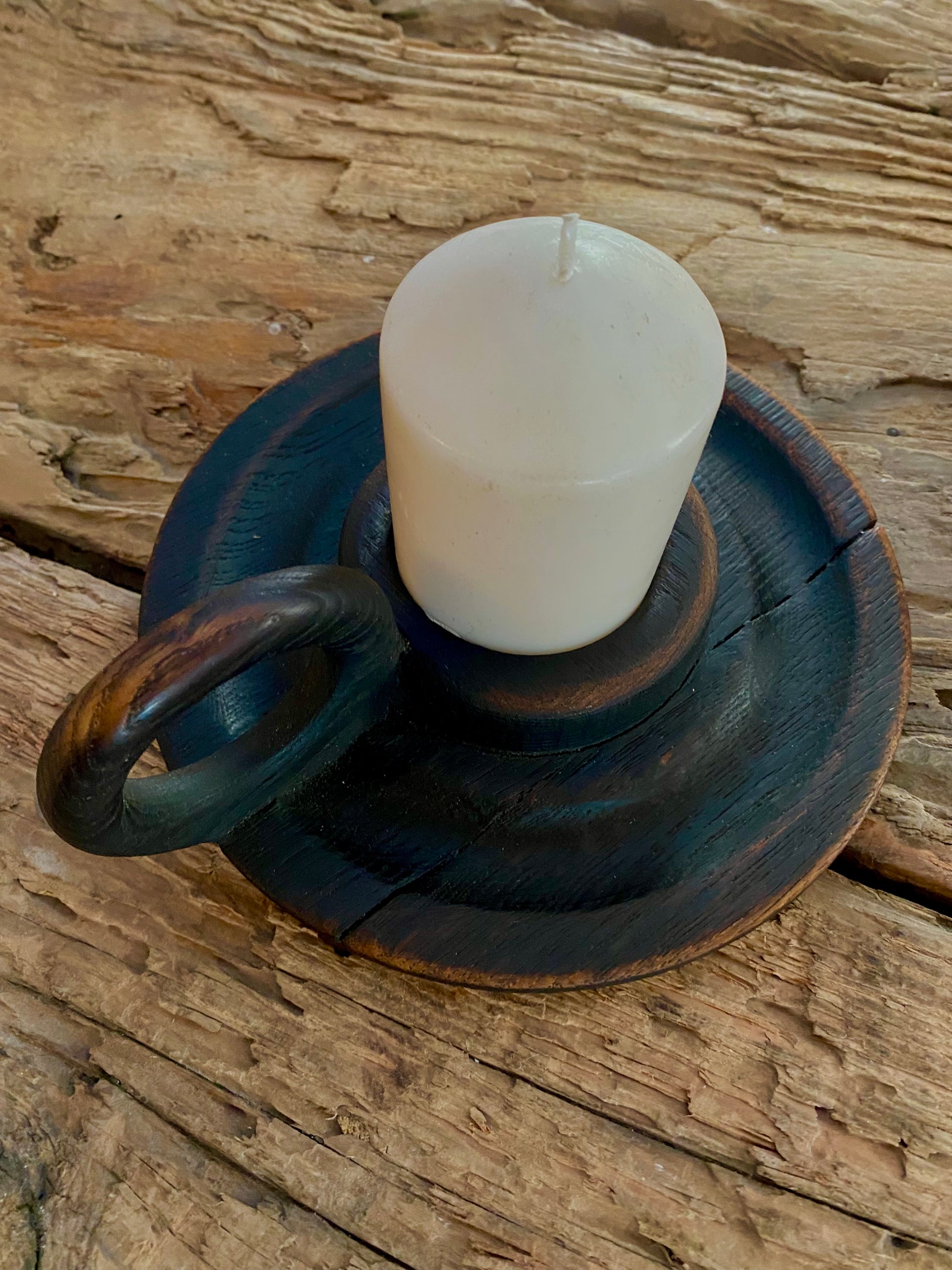 Elegant church candle holder with a charred surface texture, designed with a vintage Victorian style and a finger ring loop for easy transport. Crafted from reclaimed wood
