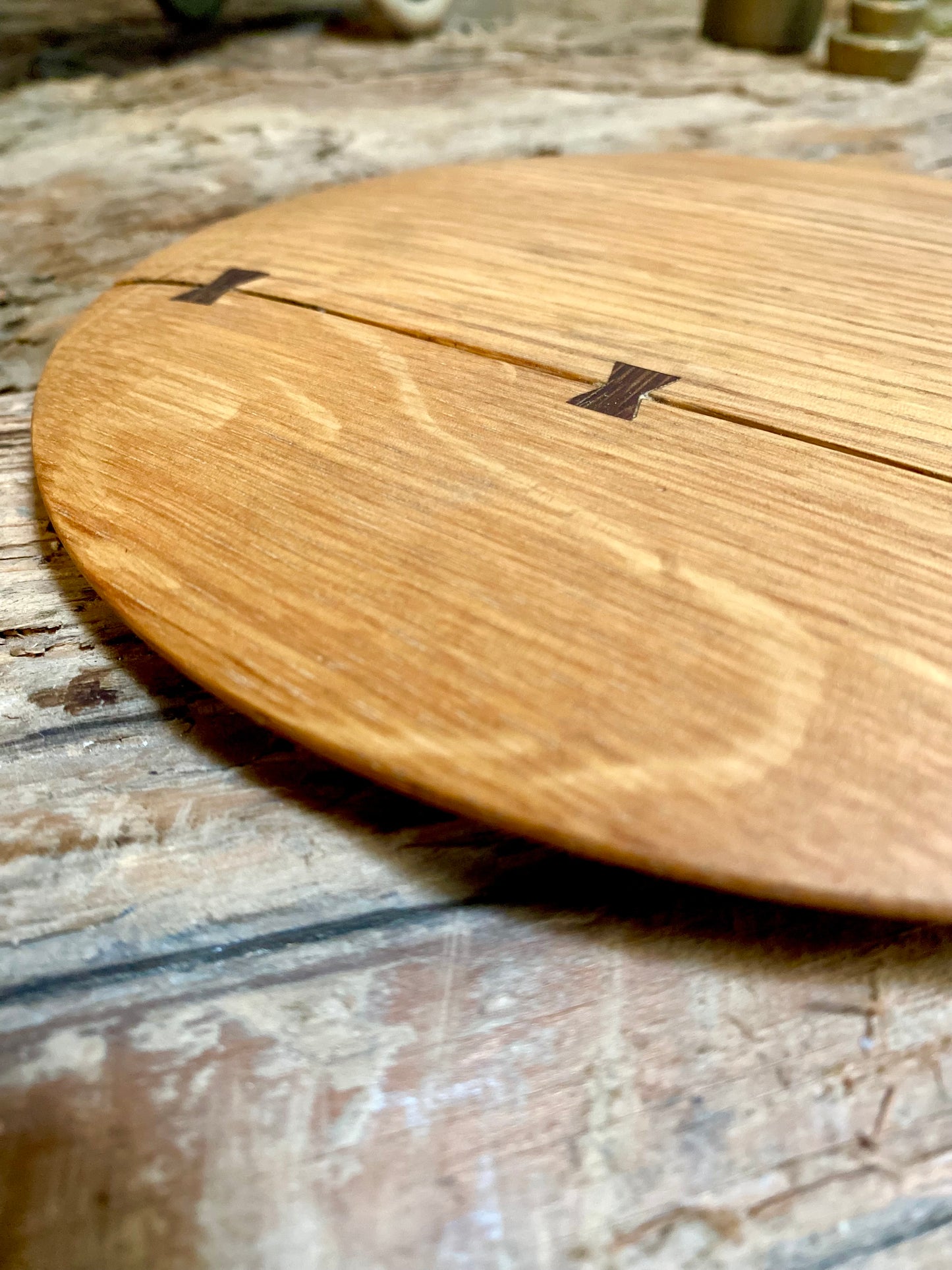 Round cutting serving tray board made with reclaimed oak with traditional walnut bowtie joinery