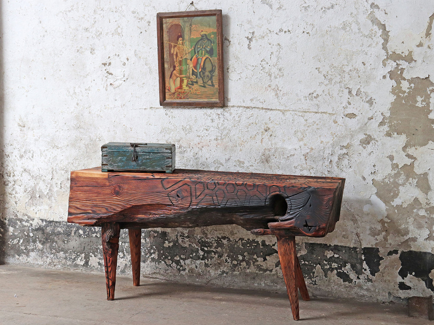 Driftwood bench with carved mandala sacred geometry pattern