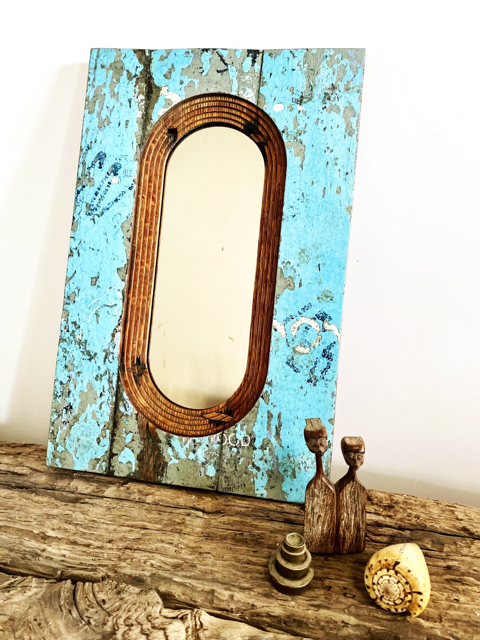 Shabby chic surface texture on an upcycled wall mirror