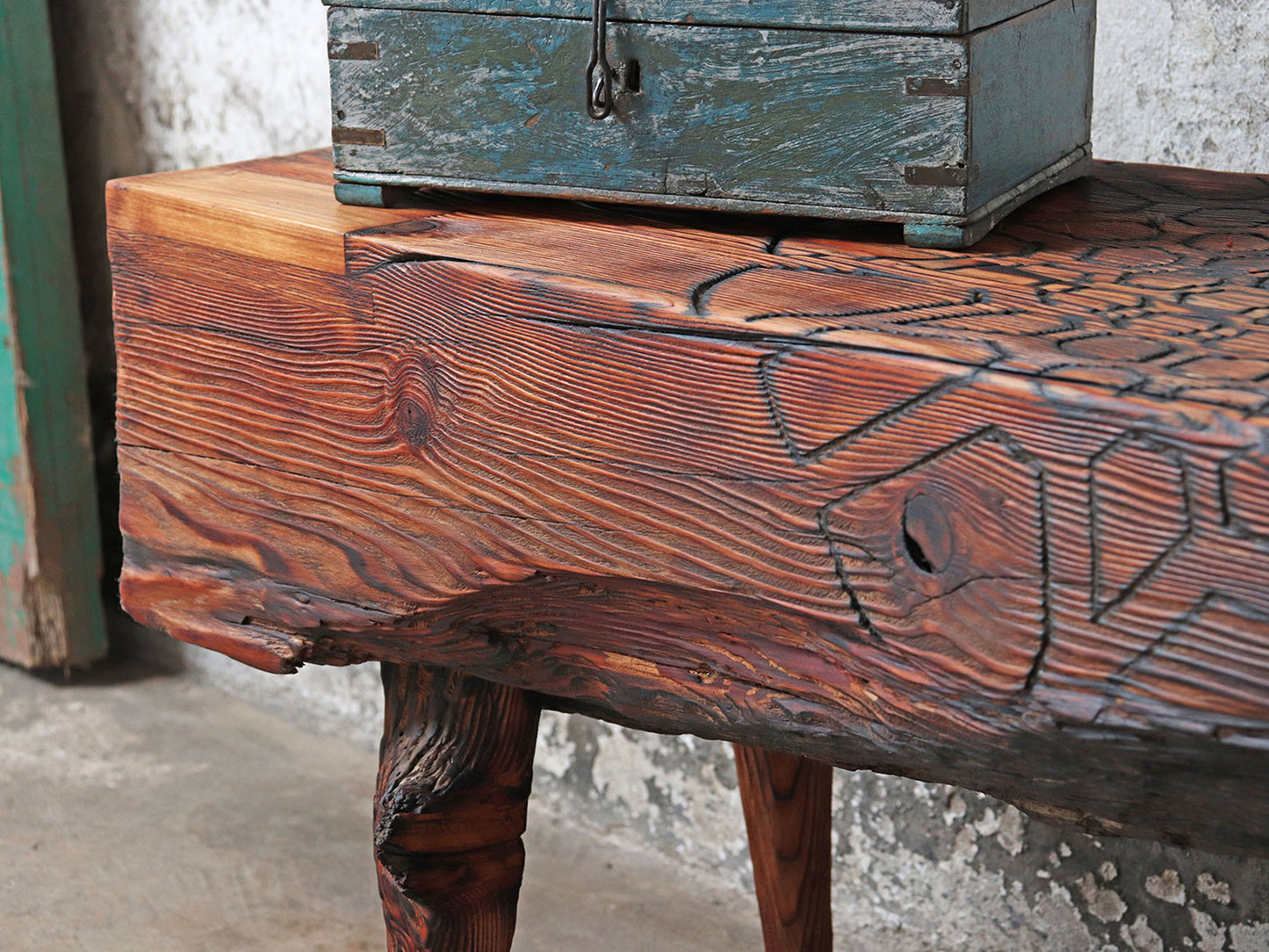 Driftwood bench with carved mandala sacred geometry pattern