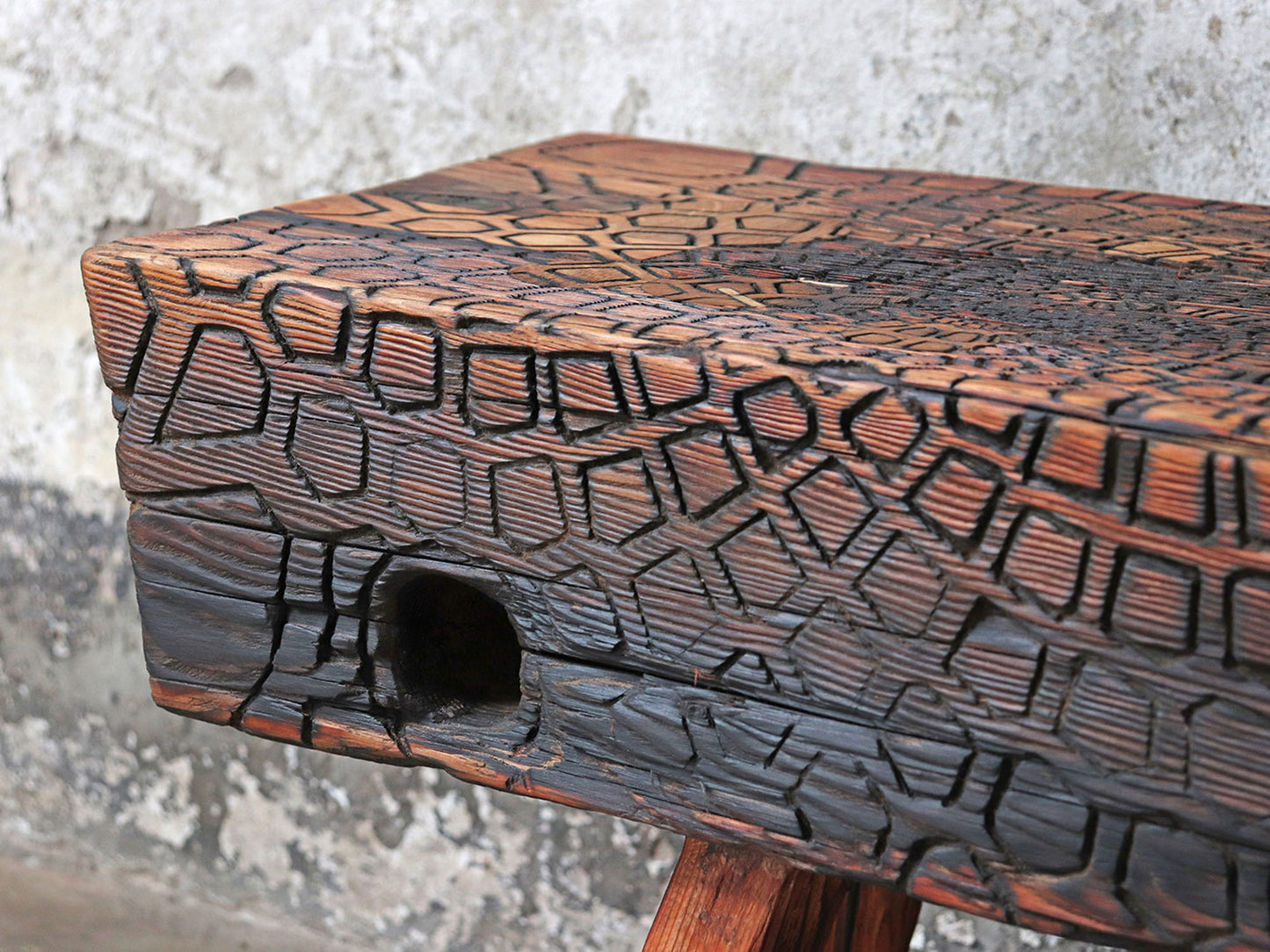 Driftwood bench with carved mandala sacred geometry pattern