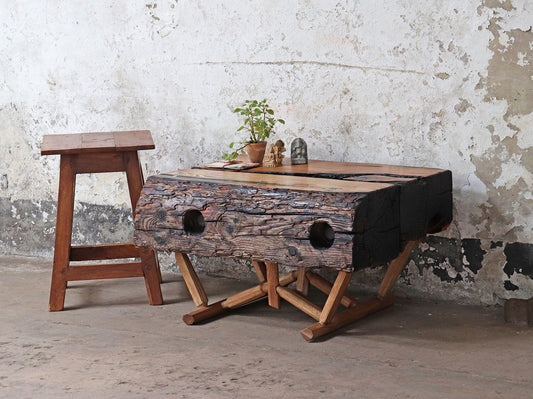 neo-primitive driftwood coffee or centre table with a live edge and a distinctive modern rustic oak stand and finished with the Shou Sugi Ban technique