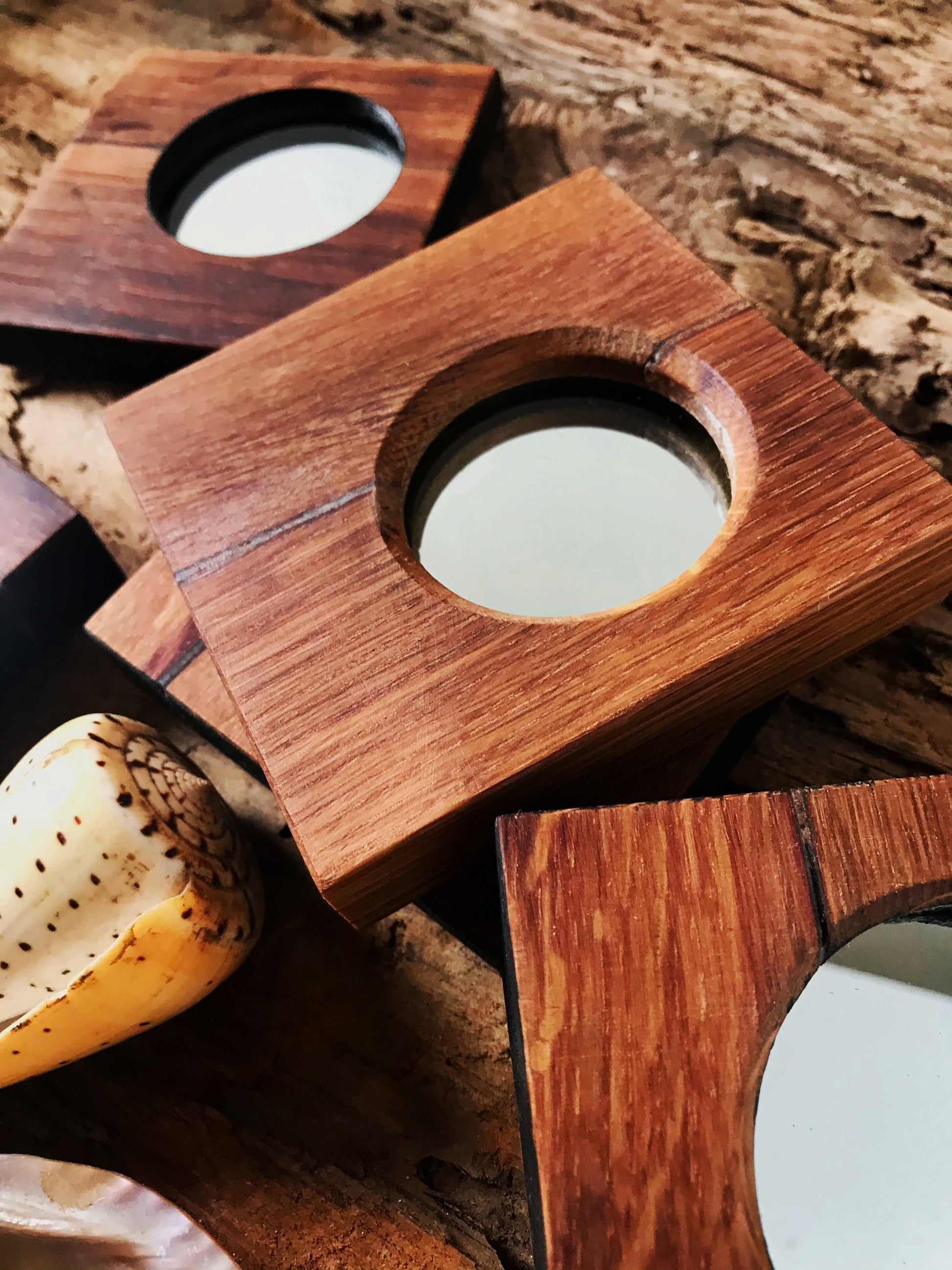 Modern rustic hand vanity mirror with a square profile and circular mirror. Giftable gift to show you care.