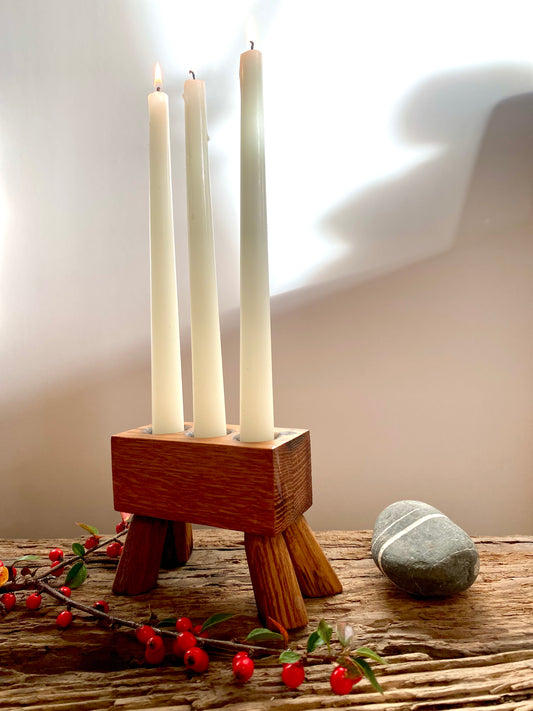 A modern rustic triple-candle holder stand, handcrafted from a reclaimed oak whisky barrel - Perfect for gifting or creating ambient lighting in your favourite place.