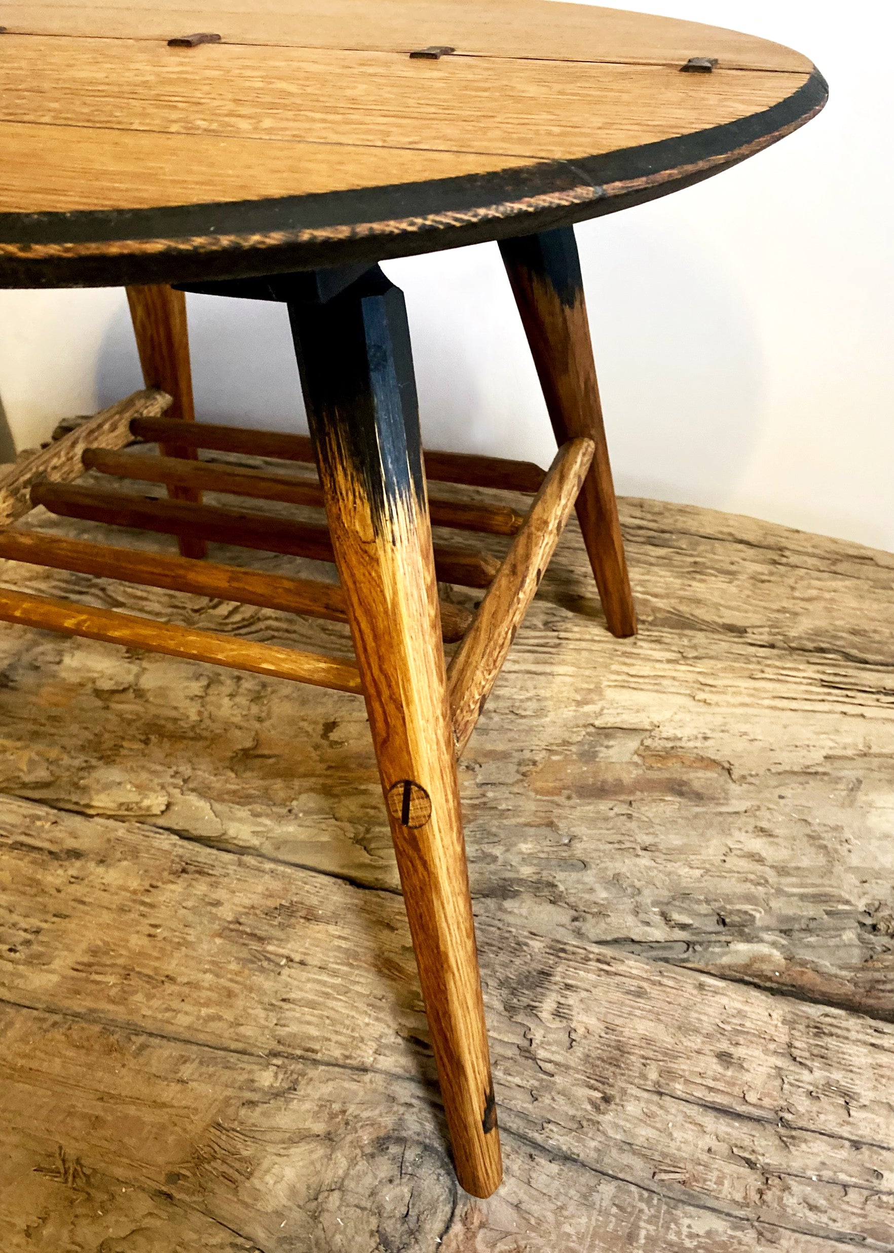 Mid-century designed rustic coffee table with tapered legs and butterfly joinery