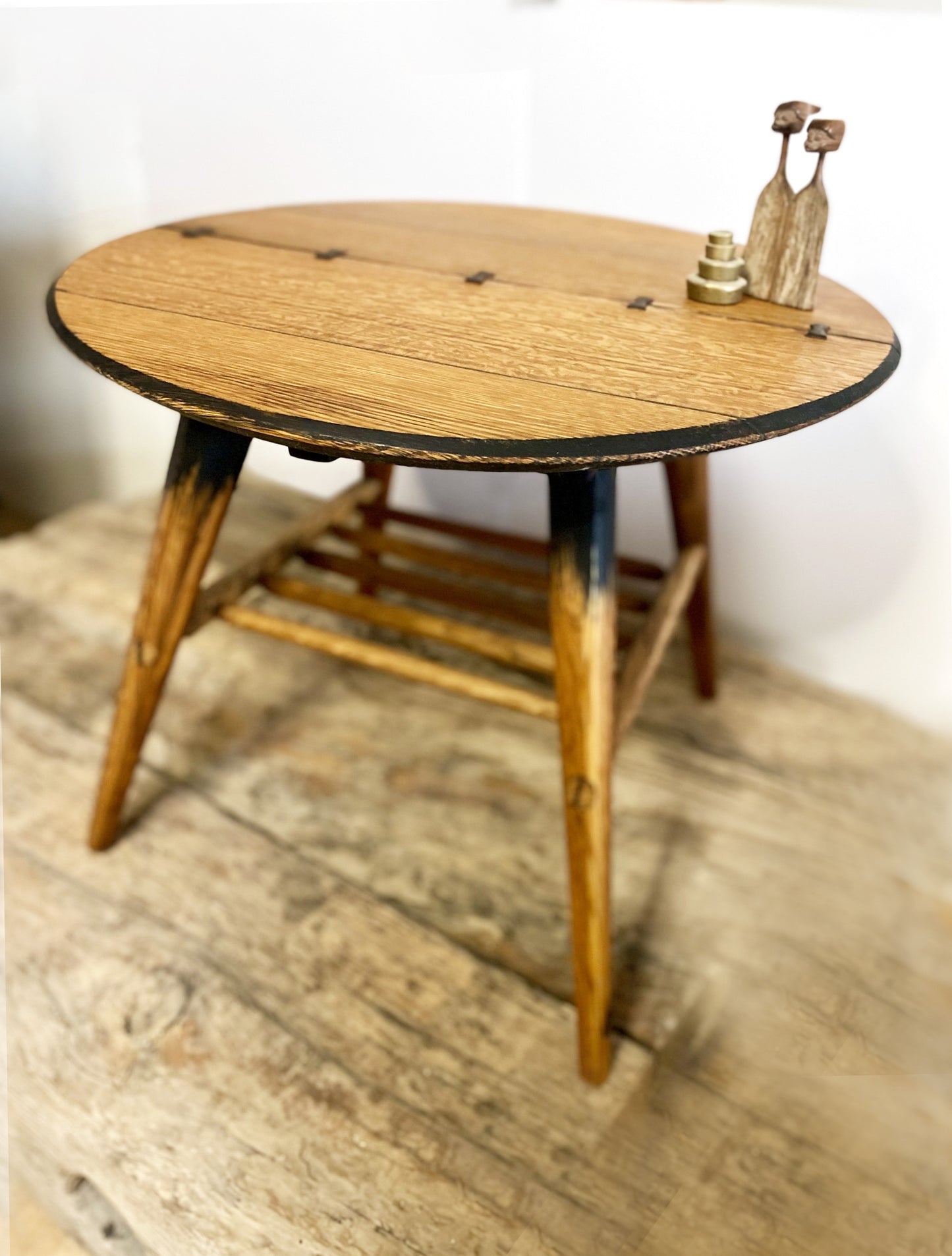 Mid-century designed rustic coffee table with tapered legs and butterfly joinery