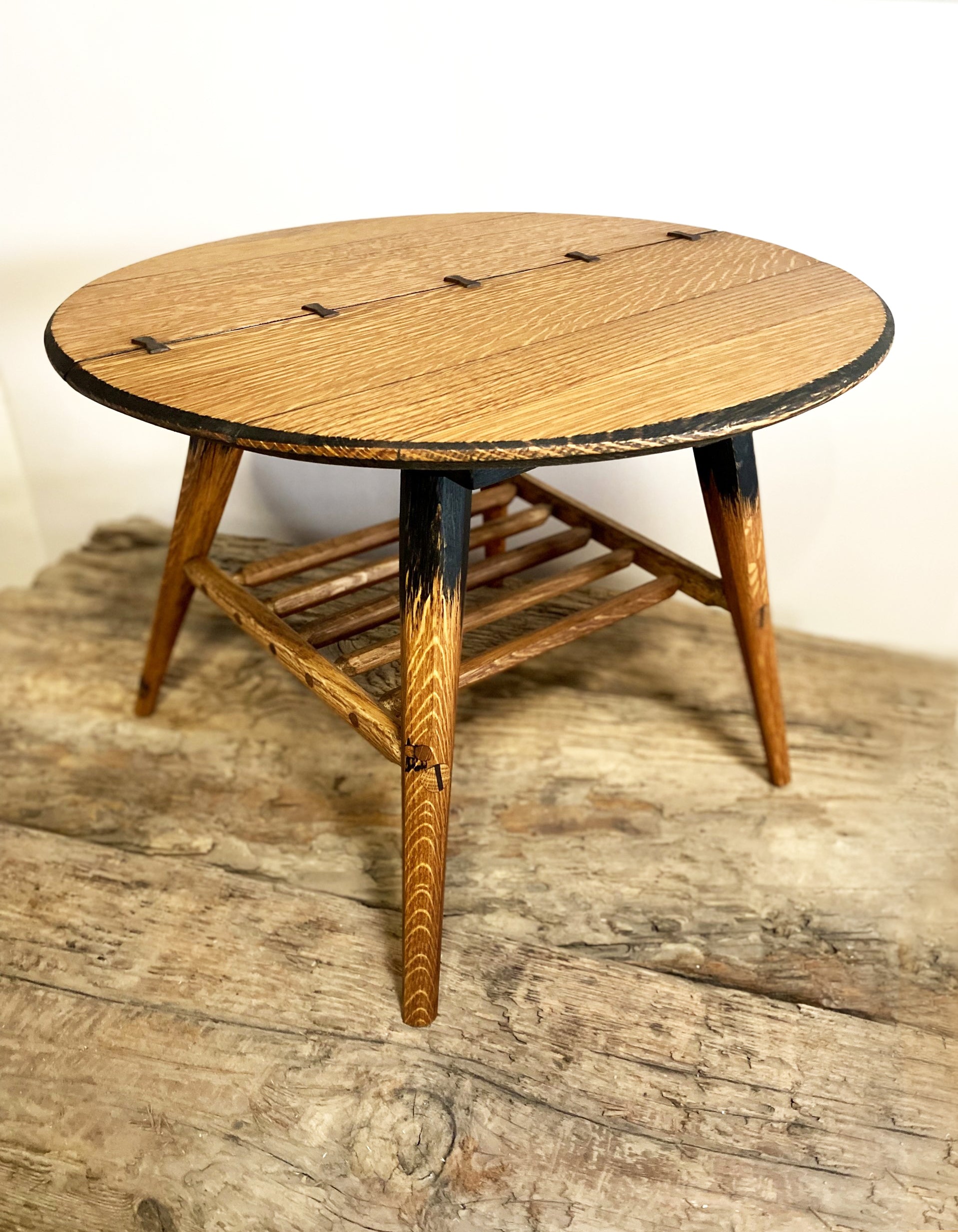 Mid-century designed rustic coffee table with tapered legs and butterfly joinery