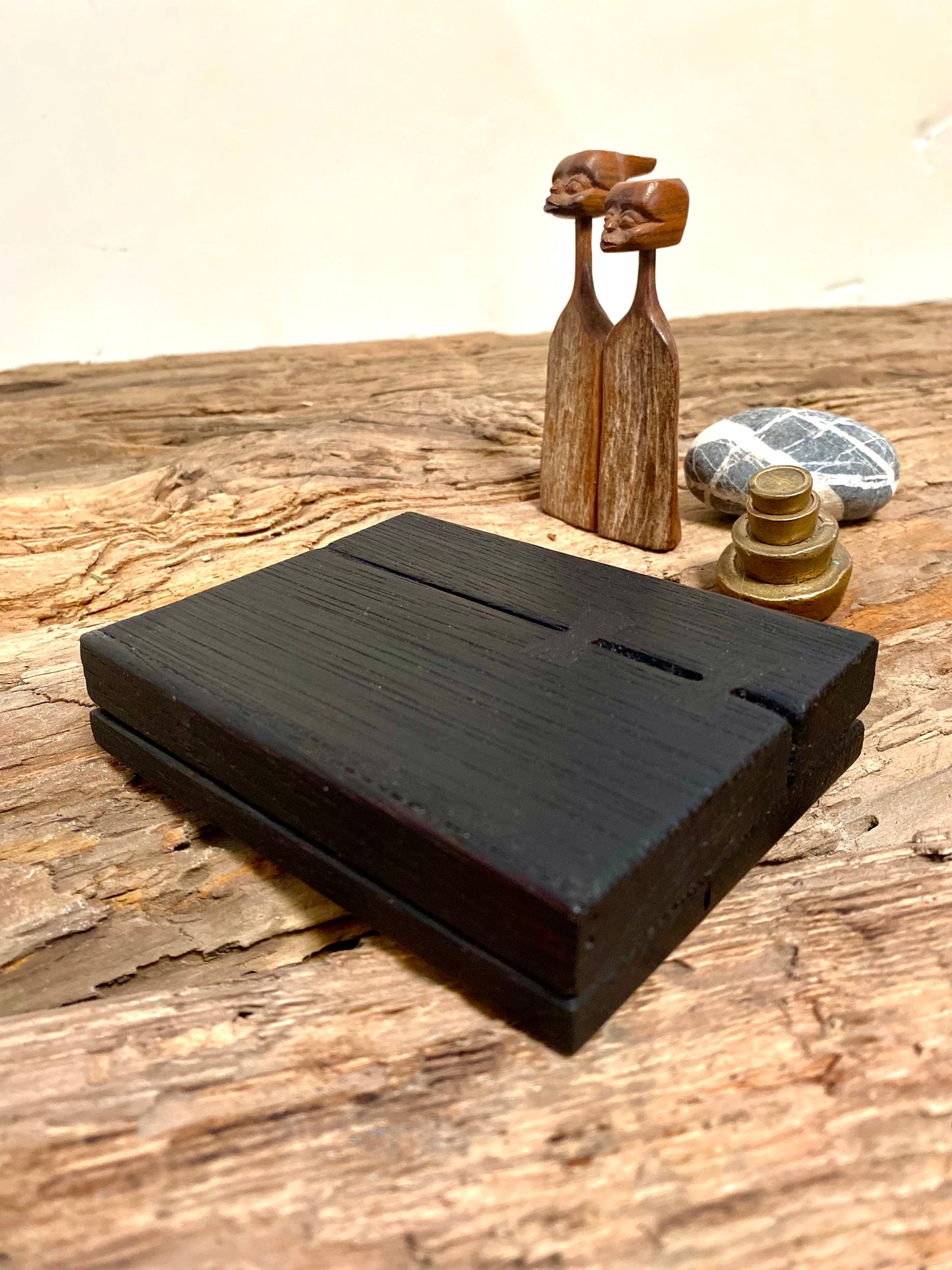 Handcrafted reclaimed oak chest with striking charred surface texture, perfect as a matchbox for fireside ambiance or rustic decor. Sustainable design with color-tipped matches, bowtie joinery, and a convenient strike lid—functional and stylish for home rituals