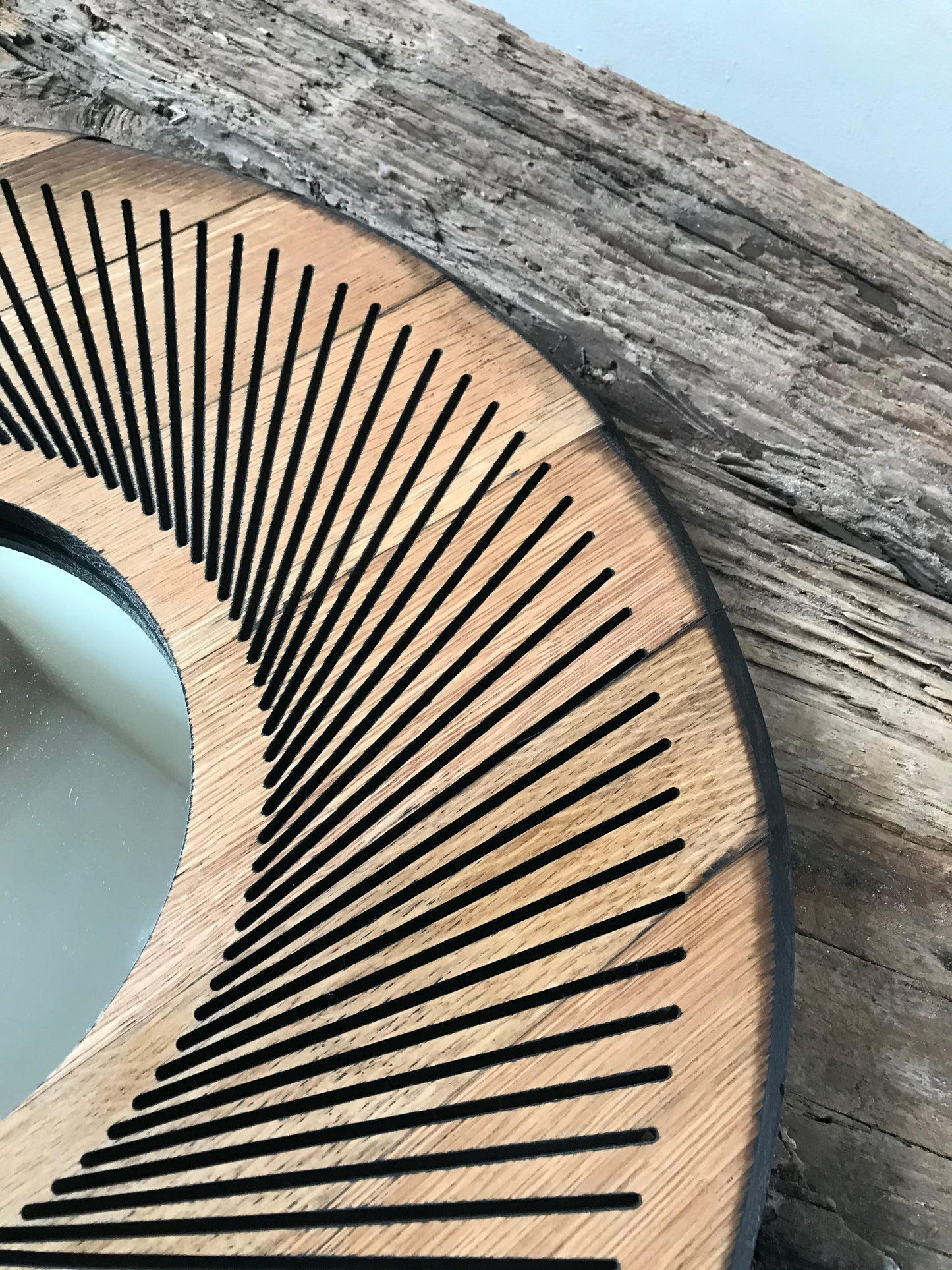 Unique upcycled wall mirror crafted from a Scottish whisky barrel lid, featuring sacred geometry patterns, rustic oak grain, and subtle patina. A perfect eco-friendly decor piece for modern homes