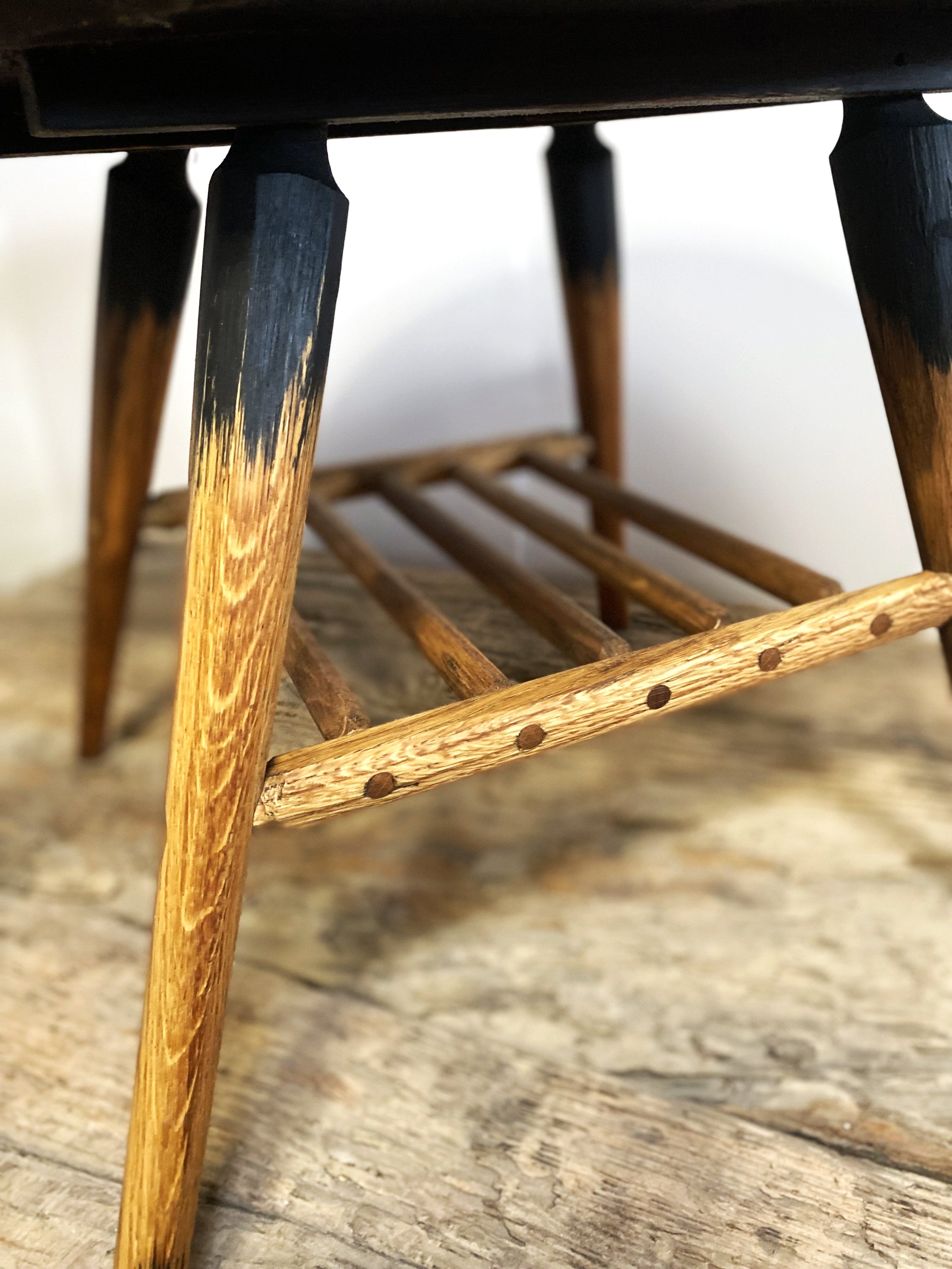 Mid-century designed rustic coffee table with tapered legs and authentic surface texture