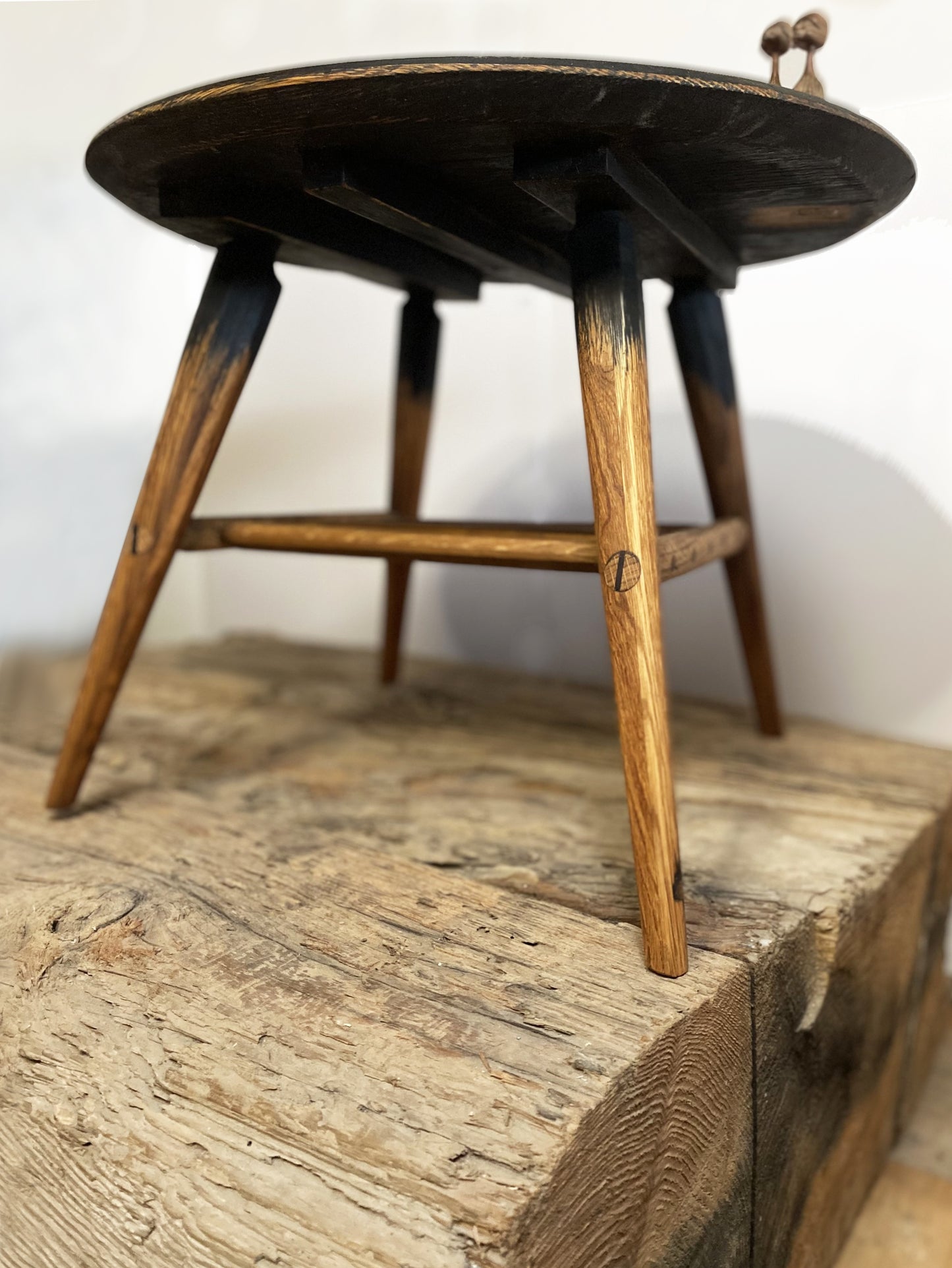 Mid-century designed rustic coffee table with tapered legs and butterfly joinery